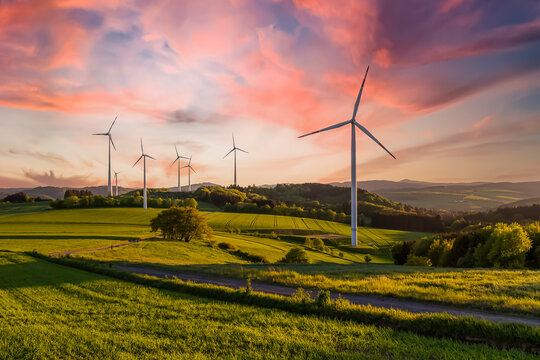 wind turbine in the field at sunset