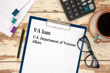 Paper with VA loan - U.S. Departament of Veterans Affairs on the table