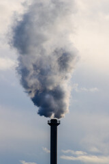 chimney with smoke by the river pollute global warming