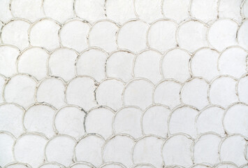 White fish scales plaster wallpaper pattern in vintage style. © Aleksei