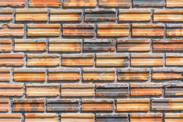 Orange color brick wall for brickwork background design