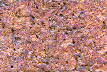 Orange volcanic basalt texture, stone - architecture background