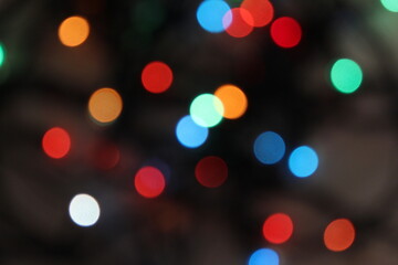 Abstract texture, multicolored blurred circles on a black background