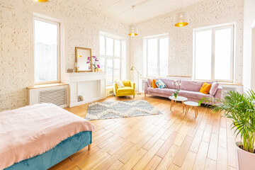 Scandinavian style apartment interior. bright yellow warm colors. wooden flooring. sunlight in large windows.