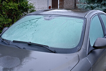 car glass covered with ice