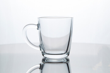 Tea mug made of transparent glass.Close-up.