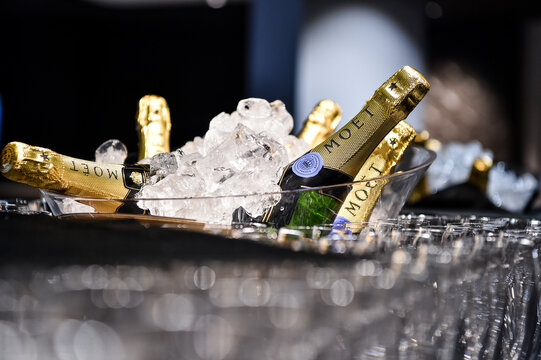 France, Paris 01-10-2021 Moet & Chandon champagne tasting in event. Many glasses and bottles of champagne in to the ice with Moet & Chandon logo