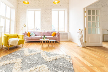 Scandinavian style apartment interior. bright yellow warm colors. wooden flooring. sunlight in large windows.