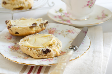 Scones a classic British cake filled with sultanas and raisins and often served buttered during...