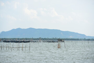 Lake view with a living room in the middle of the water Traditional fishing equipment and villager boats