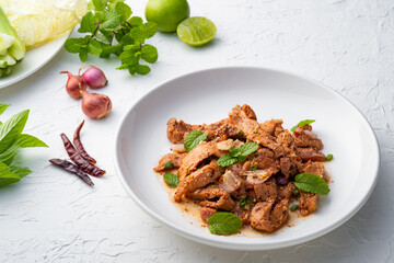 Popular Thai food.Spicy Grilled Pork Salad,grill pork with Charcoal and sliced mixed with lime juice,fish sauce,sugar and chilli flakes (Moo Nam Tok)