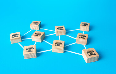Blocks with retail shops connected by lines form network business company. Franchising concept....