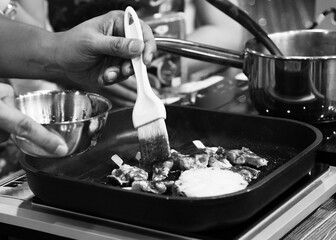Chef cooking in a kitchen, chef at work, Black and White.