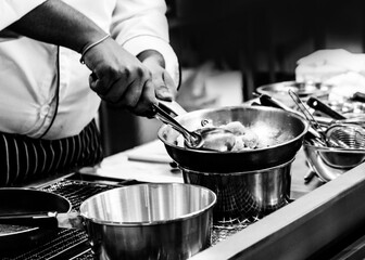 Chef cooking in a kitchen, chef at work, Black and White.