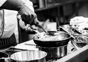 Chef cooking in a kitchen, chef at work, Black and White.