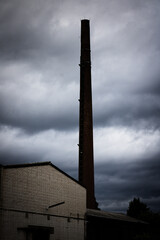 old abandoned chimney on a factory