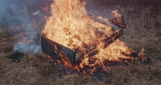 Beautiful falling, burning and crushing orange piano . Flames and smoke around. The art concept scene.