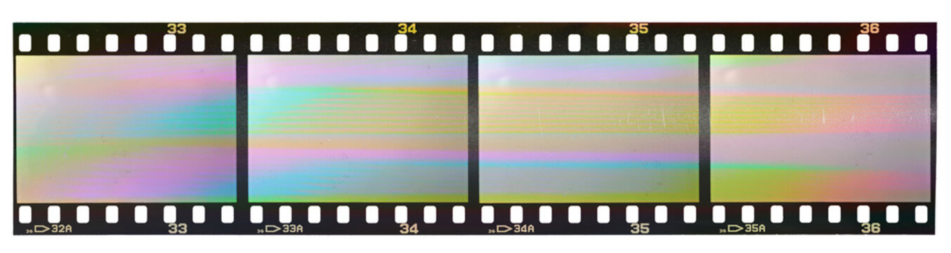 35mm positive filmstrip, blank film frames on white background, real scan of film material with cool scanning light interferences on the material.