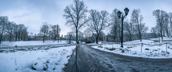 Panoramic view of covered in snow city park in winter on the center of RIga, Latvia
