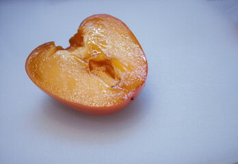 fresh ripe persimmons with leaf isolated on white background. full depth of field