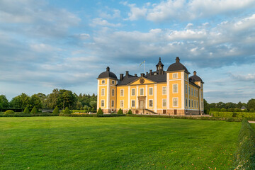 The beautiful yellow castle of Stromsholm in evening sunlight