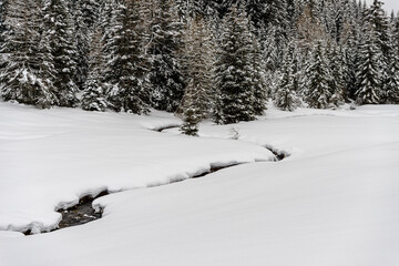 alm valley in winter with a lot of snow