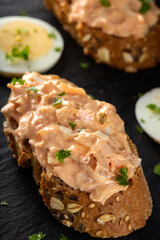 Salmon salad on bread with herbs