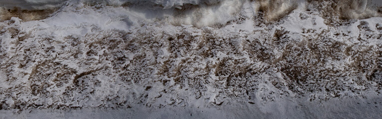 the accumulated dirty snow 