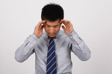 A young business man gesturing in a shirt 