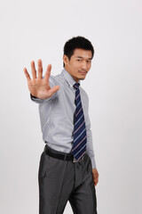 A young business man gesturing in a shirt 