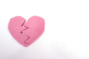Heart-shaped sausage on a white background.