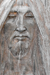 Fototapeta na wymiar Bronze bas-relief of Jesus