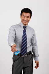 A young business man with a bank card