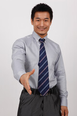 A young business man gesturing in a shirt 
