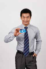 A young business man with a bank card