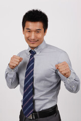 A young business man standing in a shirt