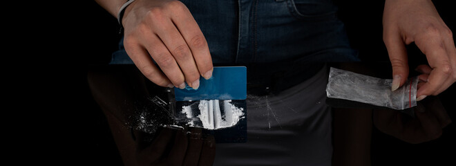 Drug addict woman snorting cocaine powder with rolled dollar banknote. Narcotics concept. Close-up macro shot. Panoramic shot. Panorama banner. High resolution sharp photo.