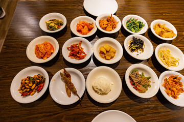 Close up shot of many delicious Korean style appetizer