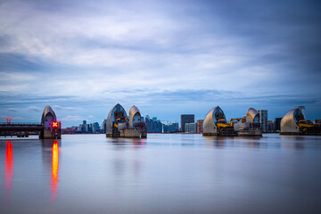 Long exposure view of Canary Wharf and Thames barrier in London