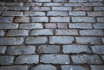vintage cobblestone, stone granite sidewalk, street in the old town, road background, close-up