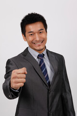 A young business man standing in a shirt 