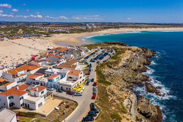 Aerial view of island Baleal naer Peniche on the shore of the ocean in west coast of Portugal. Baleal Portugal with incredible beach and surfers. Aerial view of Baleal, Portugal.