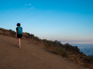 View of girl alone doing mountain hike