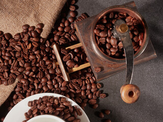 Coffee cup and coffee beans on the table