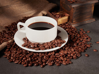 Coffee cup and coffee beans on the table