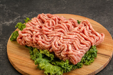 Raw pork minced meat over board