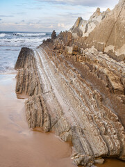 rock formations by the sea on a beach in the Basque Country