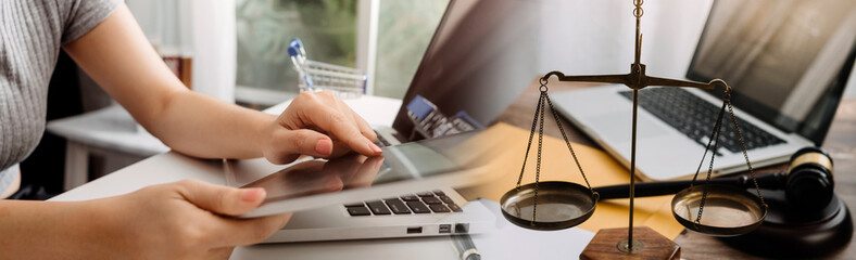 Business and lawyers discussing contract papers with brass scale on desk in office. Law, legal services, advice, justice and law concept picture with film grain effect