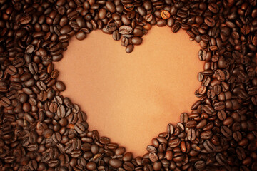 Coffee beans with shape of the heart with copy space. Top view.