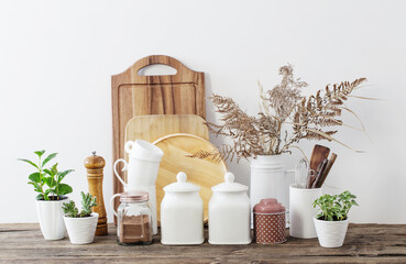 kitchen utensils on  wooden table in  white kitchen